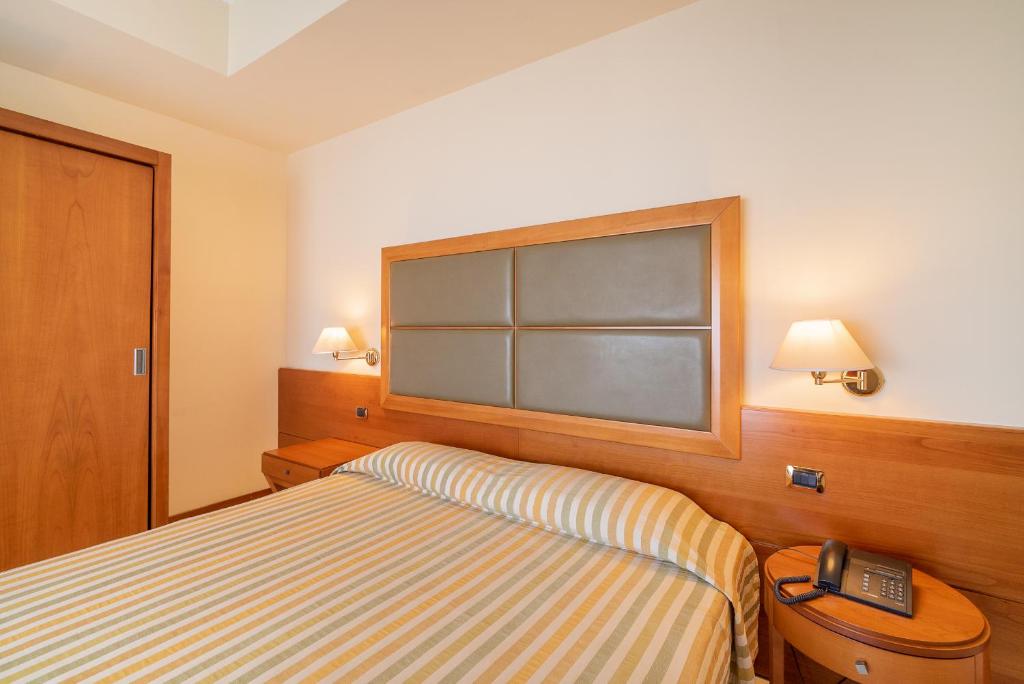 Postel nebo postele na pokoji v ubytování Grand Hotel Don Juan