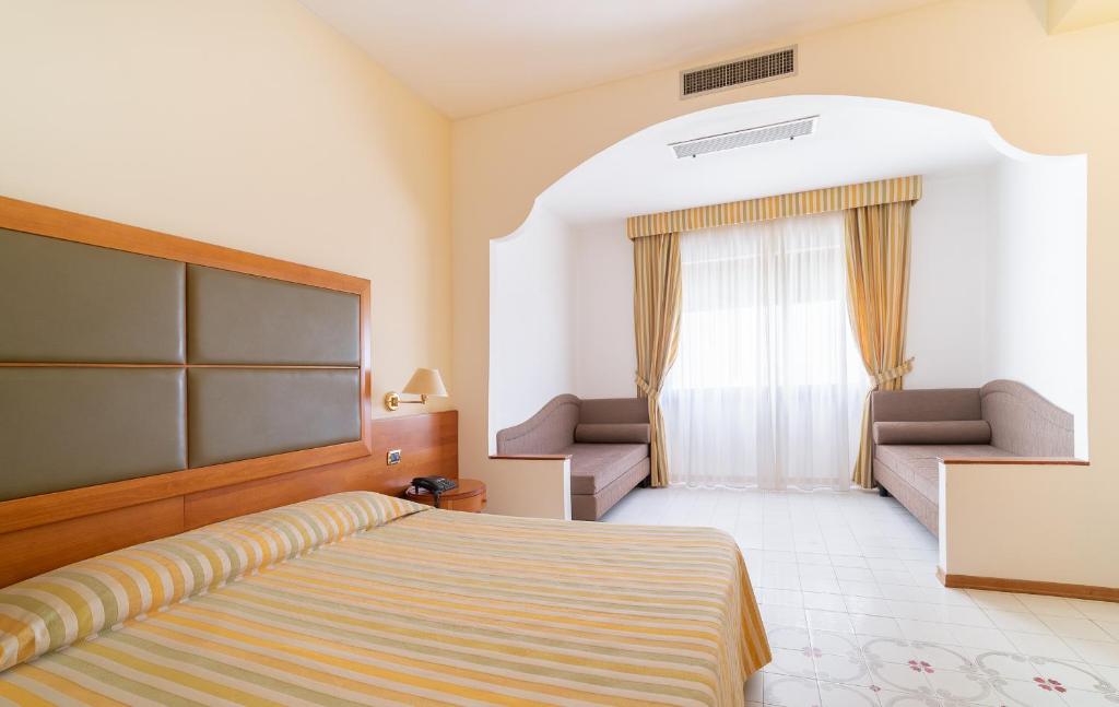 Postel nebo postele na pokoji v ubytování Grand Hotel Don Juan