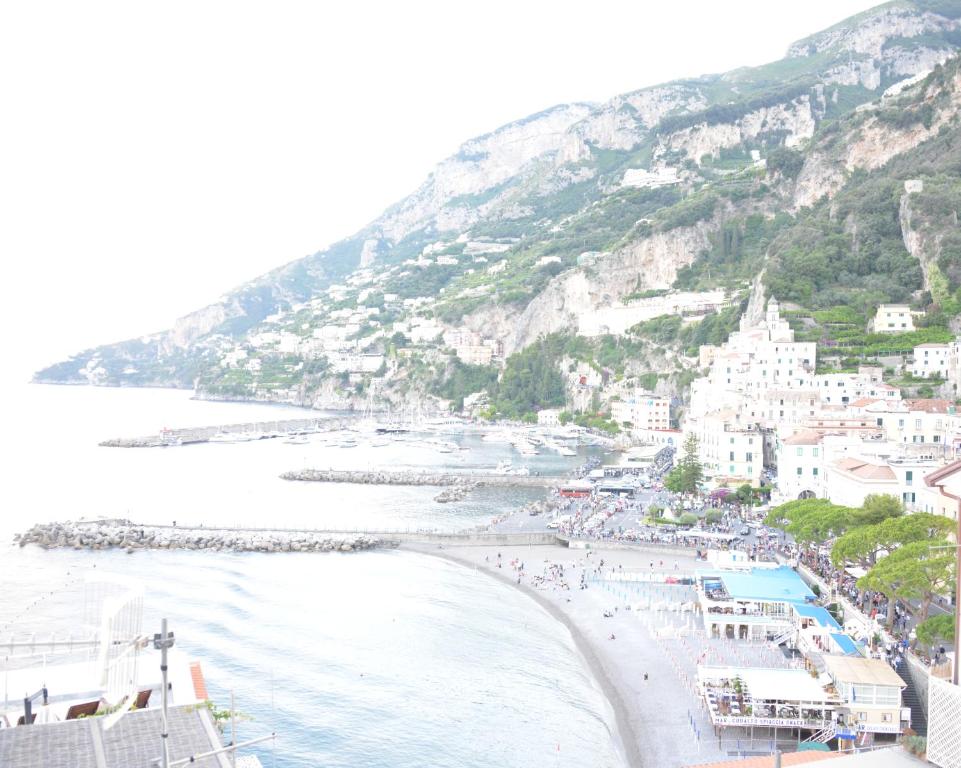 a view of a beach with a group of people at Casa della Luna in Amalfi