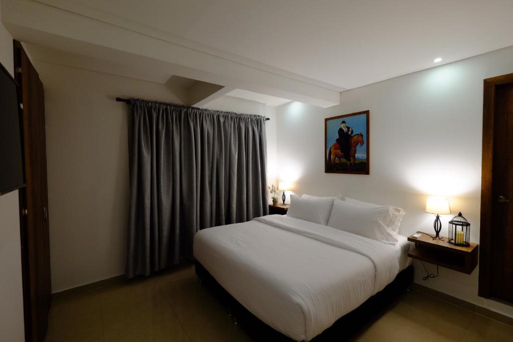 Postel nebo postele na pokoji v ubytování Hotel Amoek