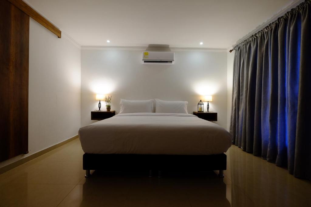 Postel nebo postele na pokoji v ubytování Hotel Amoek