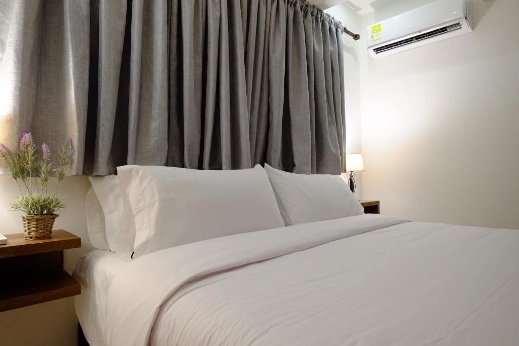 Postel nebo postele na pokoji v ubytování Hotel Amoek