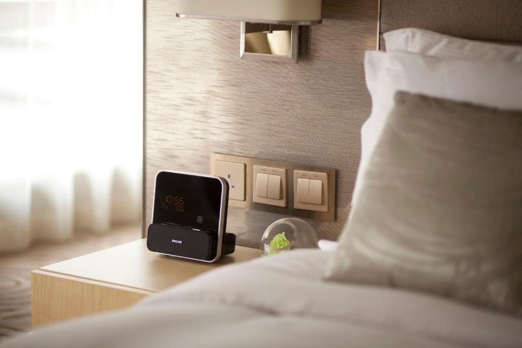 Letto o letti in una camera di The Royal Garden