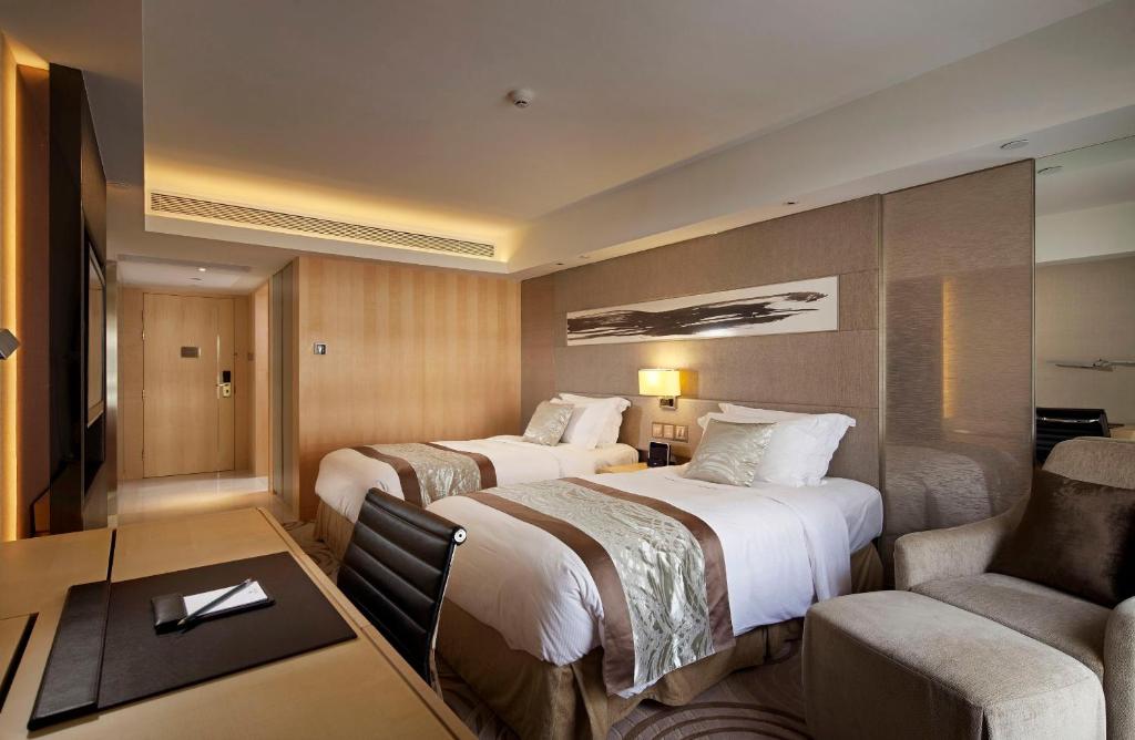 Letto o letti in una camera di The Royal Garden