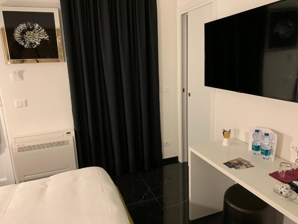 Postel nebo postele na pokoji v ubytování Voglia di Vino Locanda