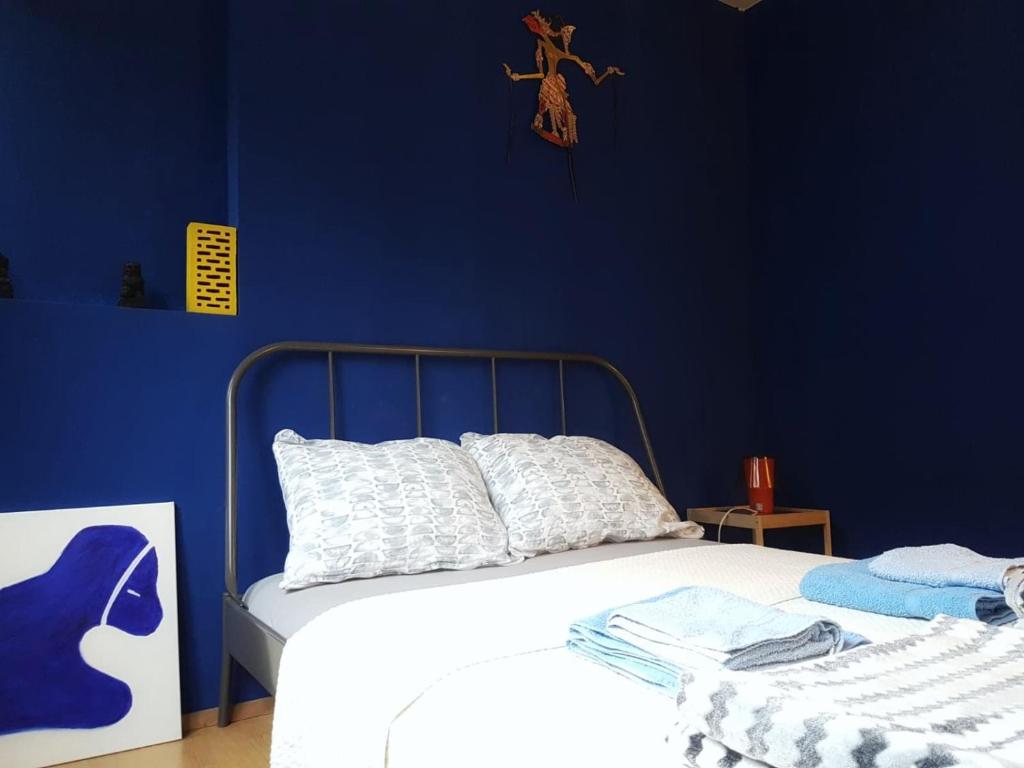 Postel nebo postele na pokoji v ubytování Blue Dreams Apartment
