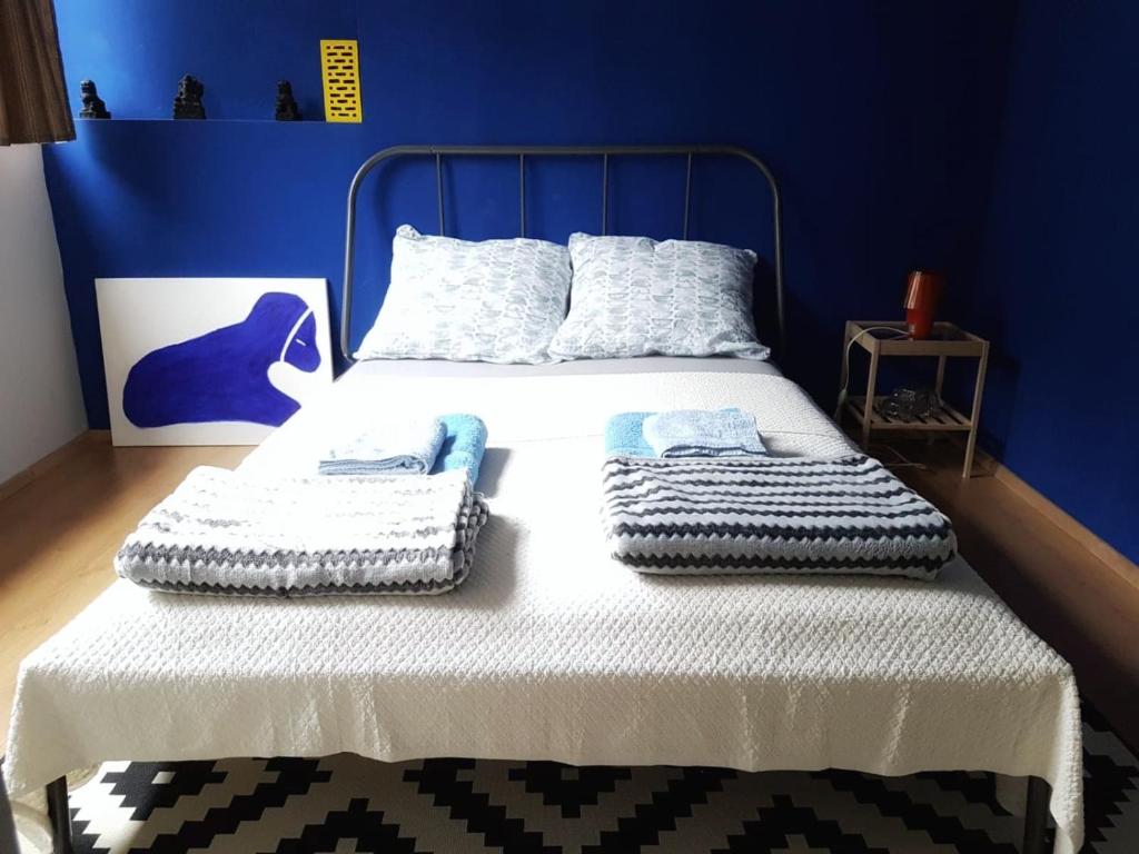 Postel nebo postele na pokoji v ubytování Blue Dreams Apartment