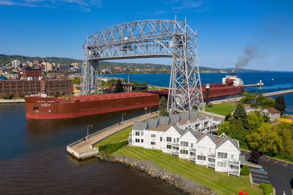 a large ship floating on top of a body of water at South Pier Inn in Duluth