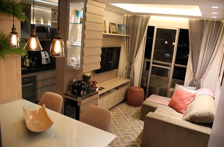 a living room with a couch and a table at Apartamento Emaús in Parnamirim