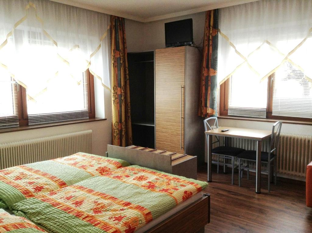 Postel nebo postele na pokoji v ubytování Pension La Mamma