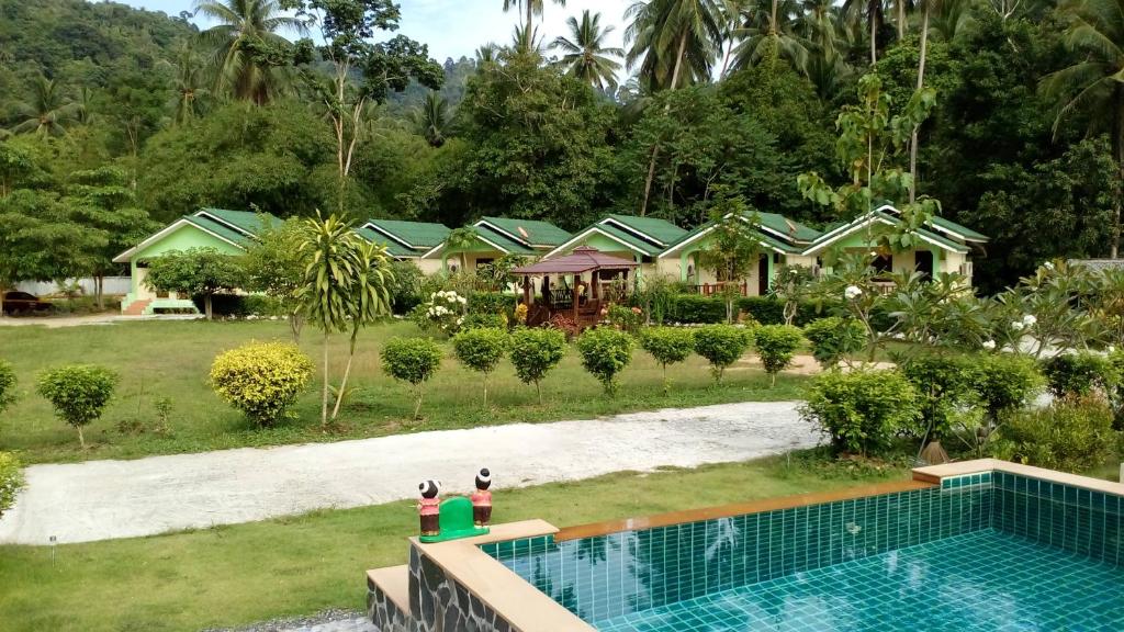 an aerial view of a house with a swimming pool at Tara Resort in Nathon