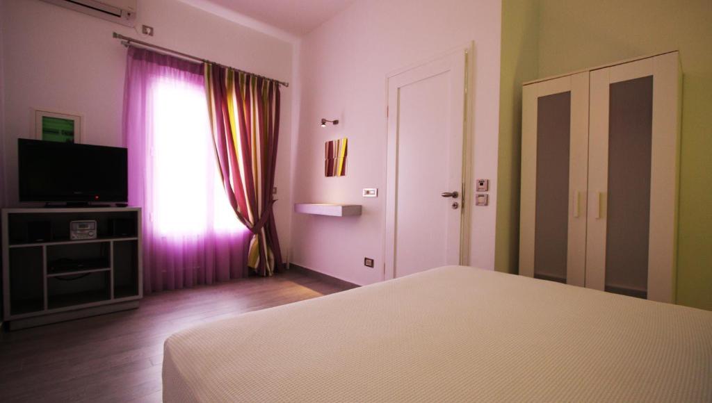 Postel nebo postele na pokoji v ubytování Efharis