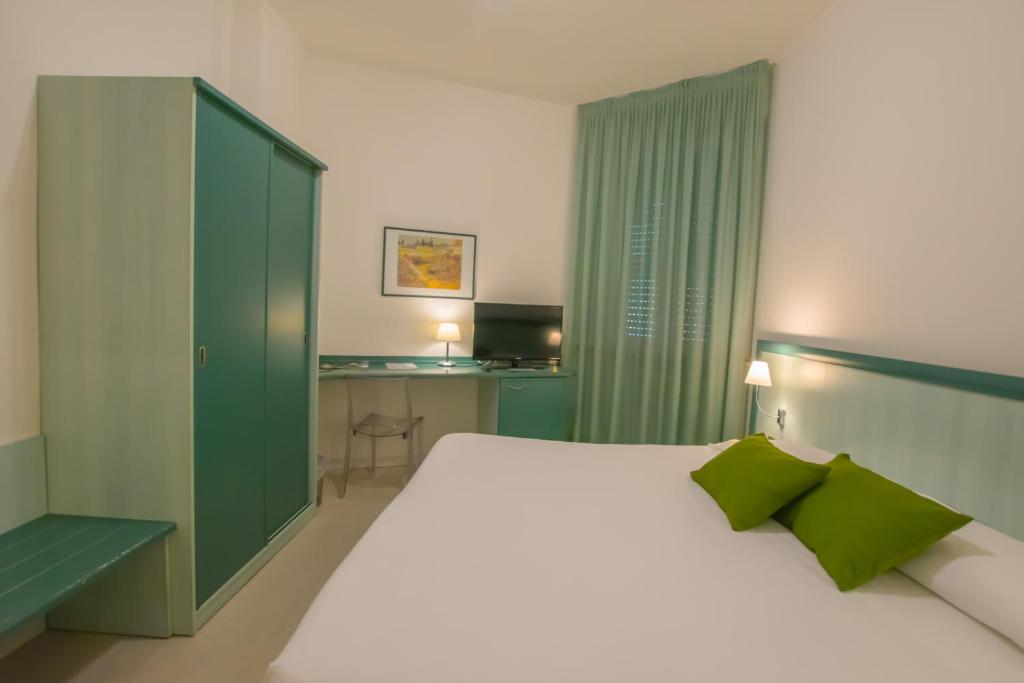 Postel nebo postele na pokoji v ubytování Hotel Europa