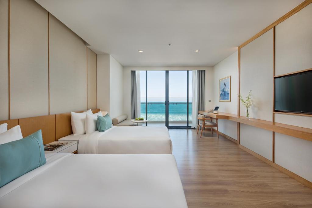 TV a/nebo společenská místnost v ubytování TMS Hotel Da Nang Beach
