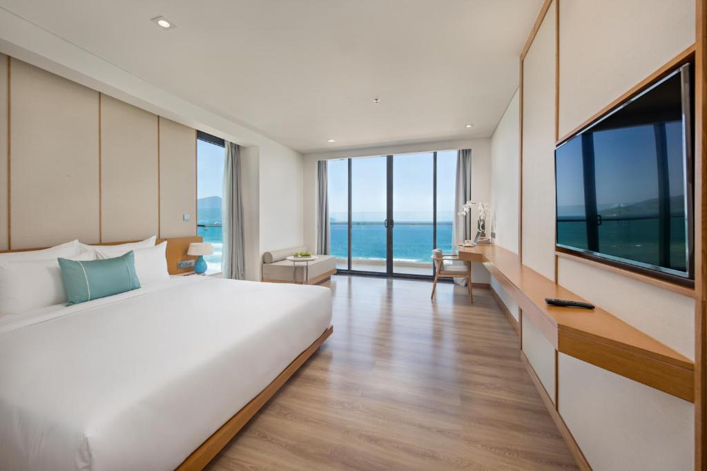 TV a/nebo společenská místnost v ubytování TMS Hotel Da Nang Beach