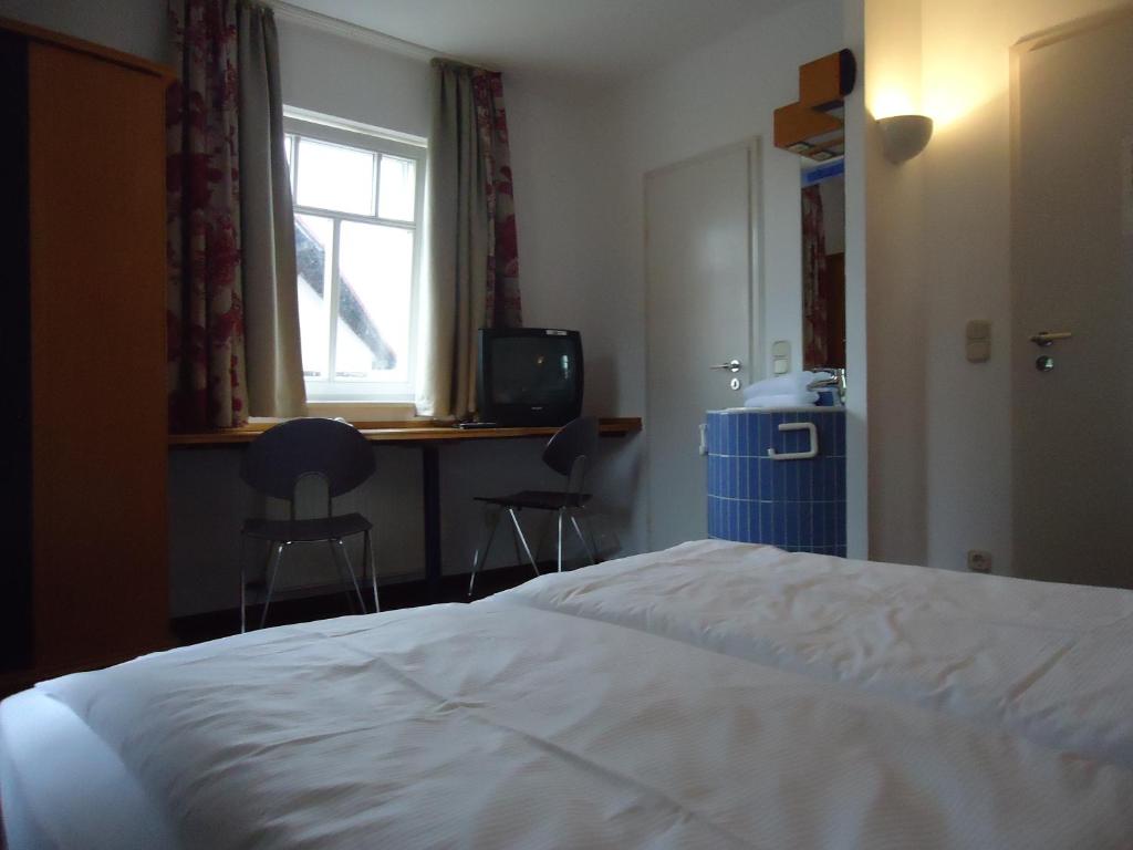 Postel nebo postele na pokoji v ubytování Garni Hotel Kaiserdom
