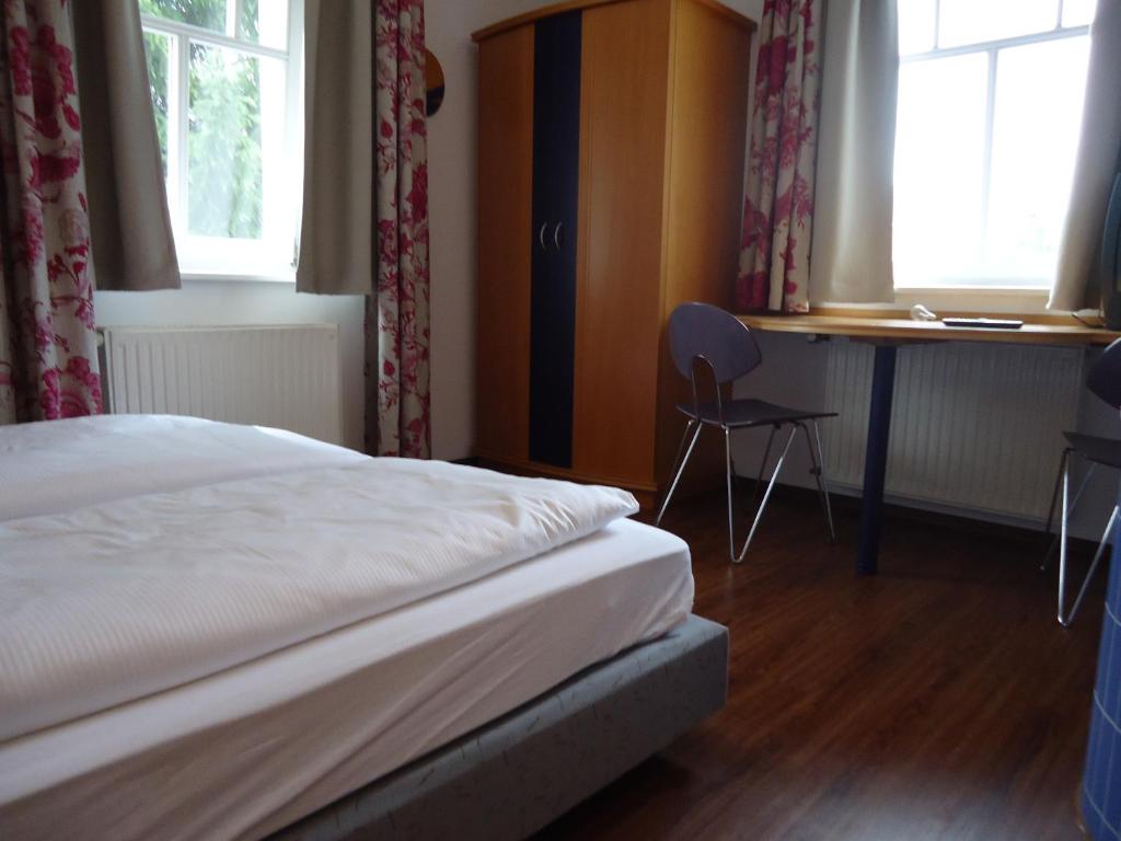 Postel nebo postele na pokoji v ubytování Garni Hotel Kaiserdom