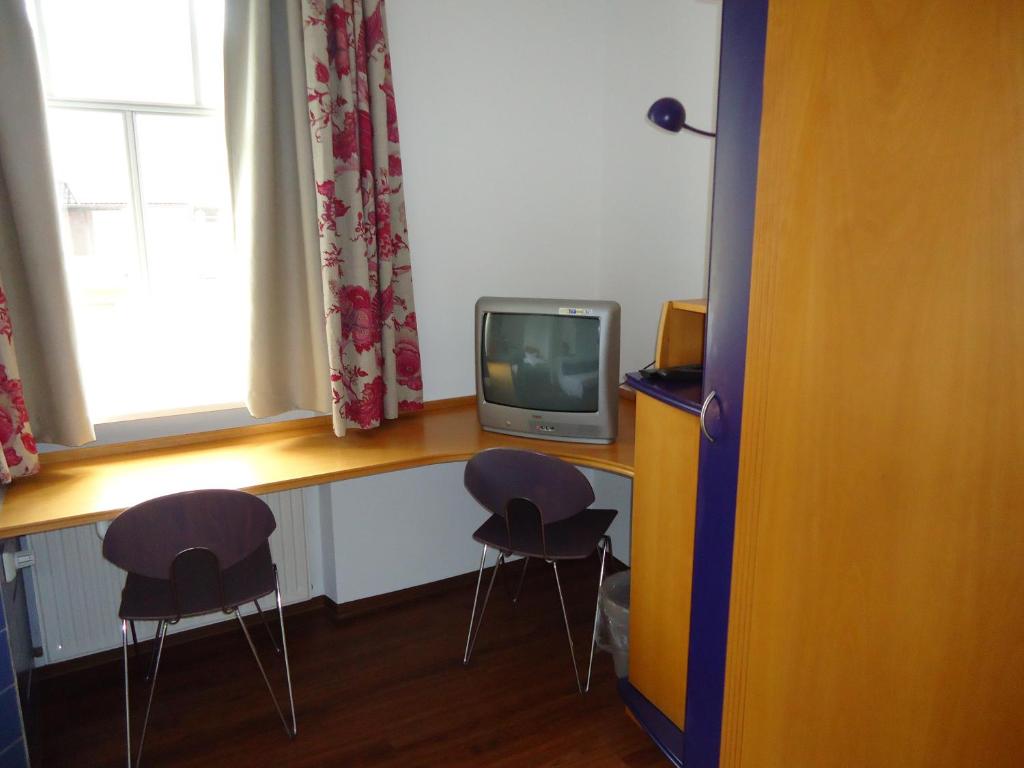 TV a/nebo společenská místnost v ubytování Garni Hotel Kaiserdom