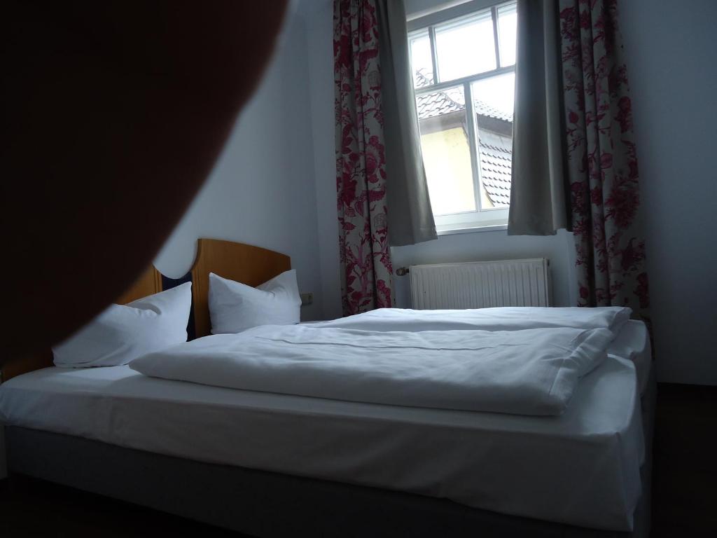Postel nebo postele na pokoji v ubytování Garni Hotel Kaiserdom
