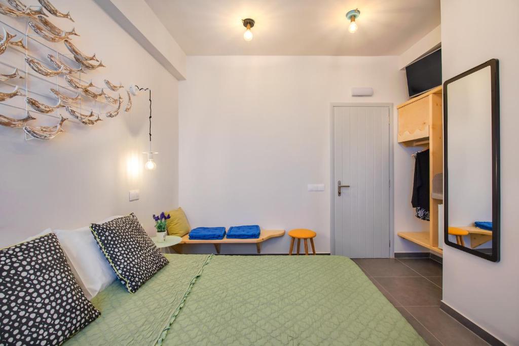 Postel nebo postele na pokoji v ubytování Afrodete Hotel