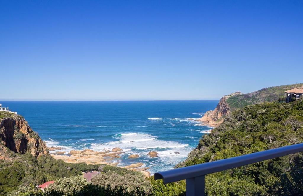 a view of the ocean from the top of a mountain at Headlands House Guest Lodge in Knysna