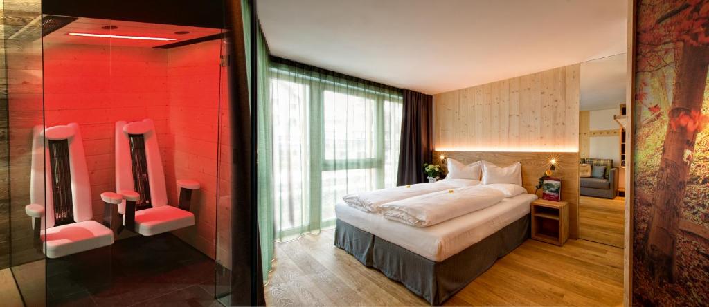 Postel nebo postele na pokoji v ubytování Mountain Design Hotel EdenSelva