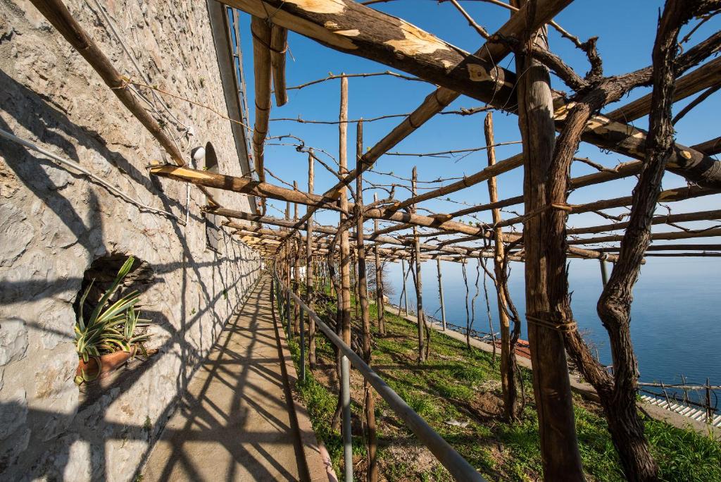 a view of the ocean from the side of a building at Albergo Diffuso Bacco Furore in Furore