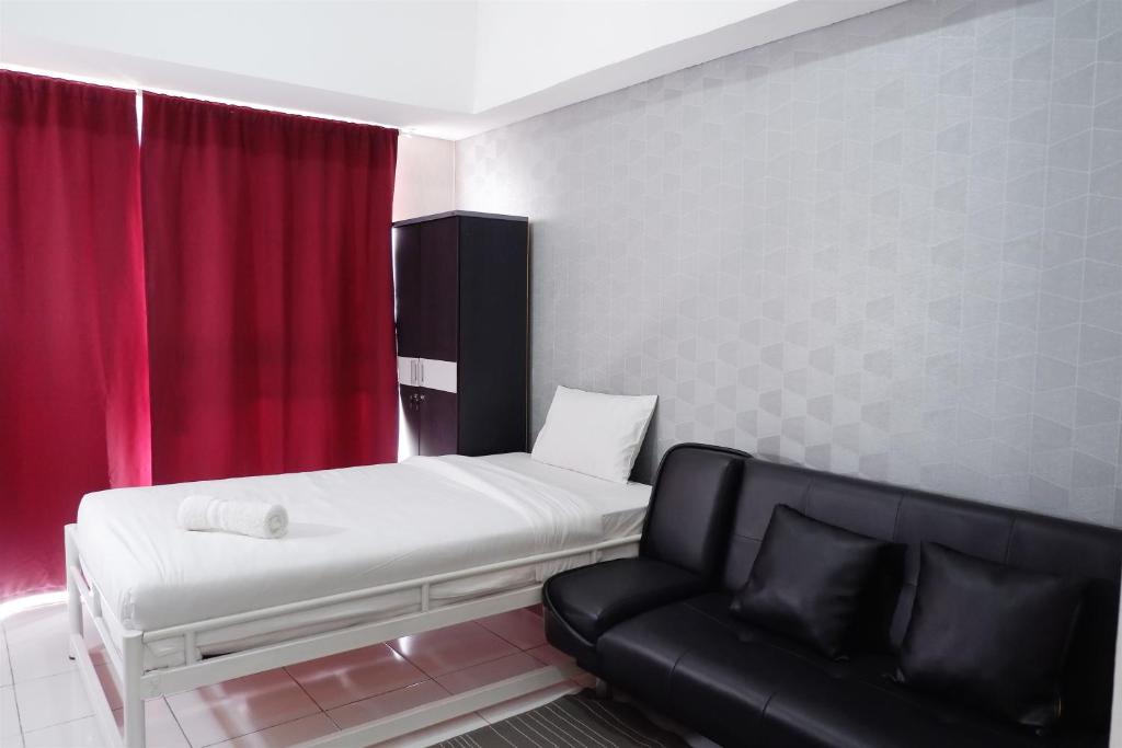 Ένα ή περισσότερα κρεβάτια σε δωμάτιο στο Comfy Studio Casa De Parco Apartment By Travelio