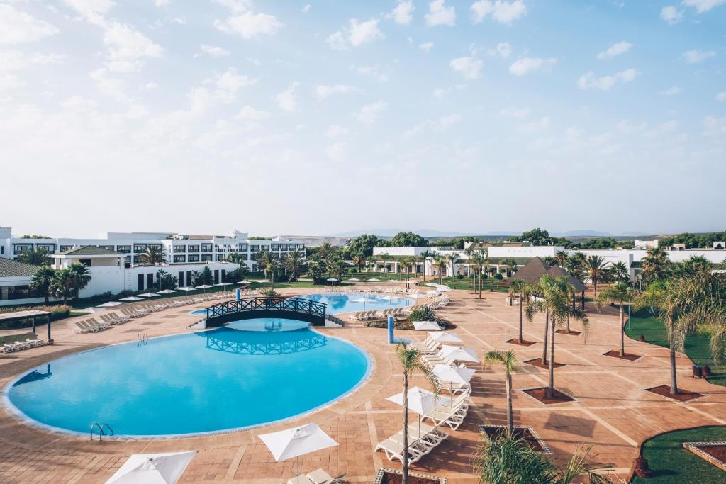an overhead view of a pool at a resort at Iberostar Waves Saidia in Saidia 