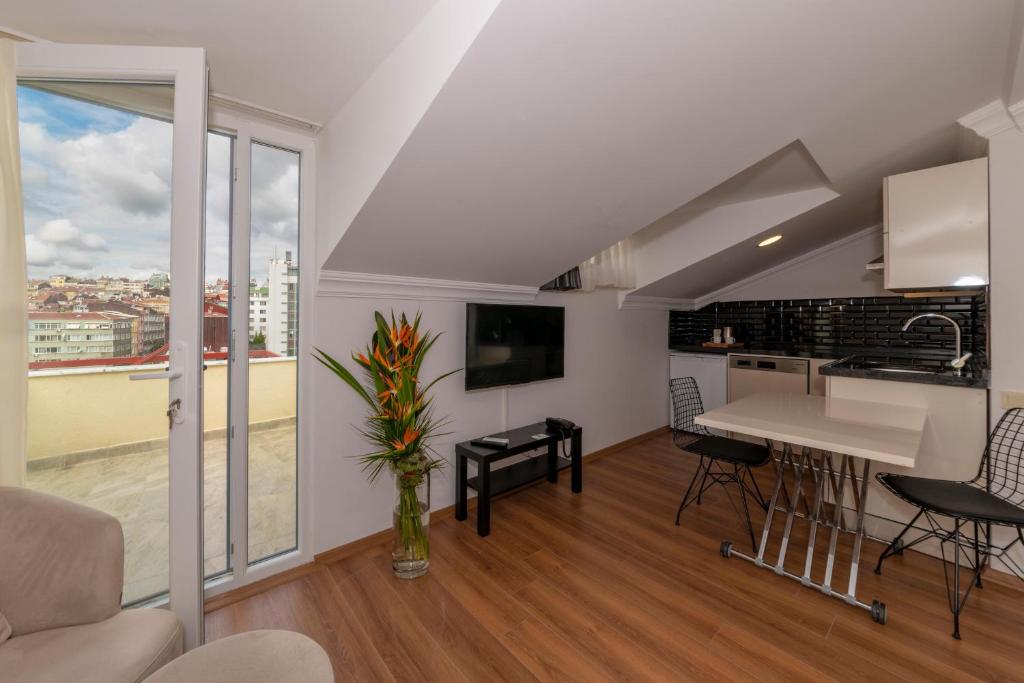 Kuchyň nebo kuchyňský kout v ubytování Joy Suites