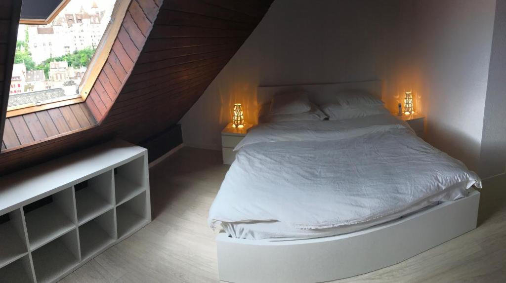 Postel nebo postele na pokoji v ubytování Residence Vue Chateau