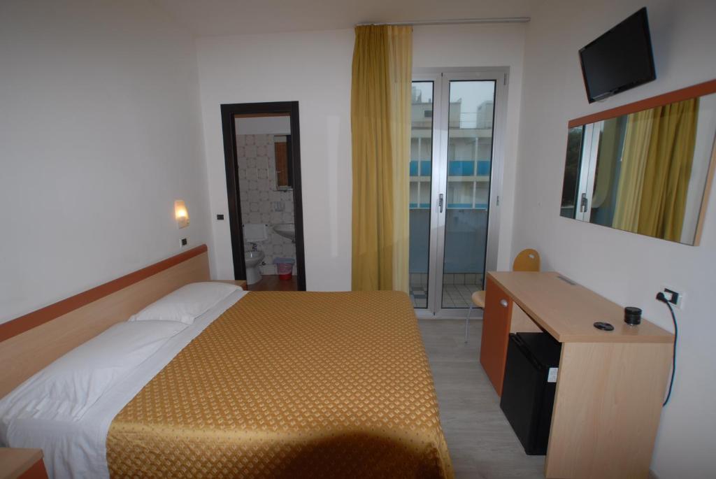 Postel nebo postele na pokoji v ubytování Hotel Tilmar