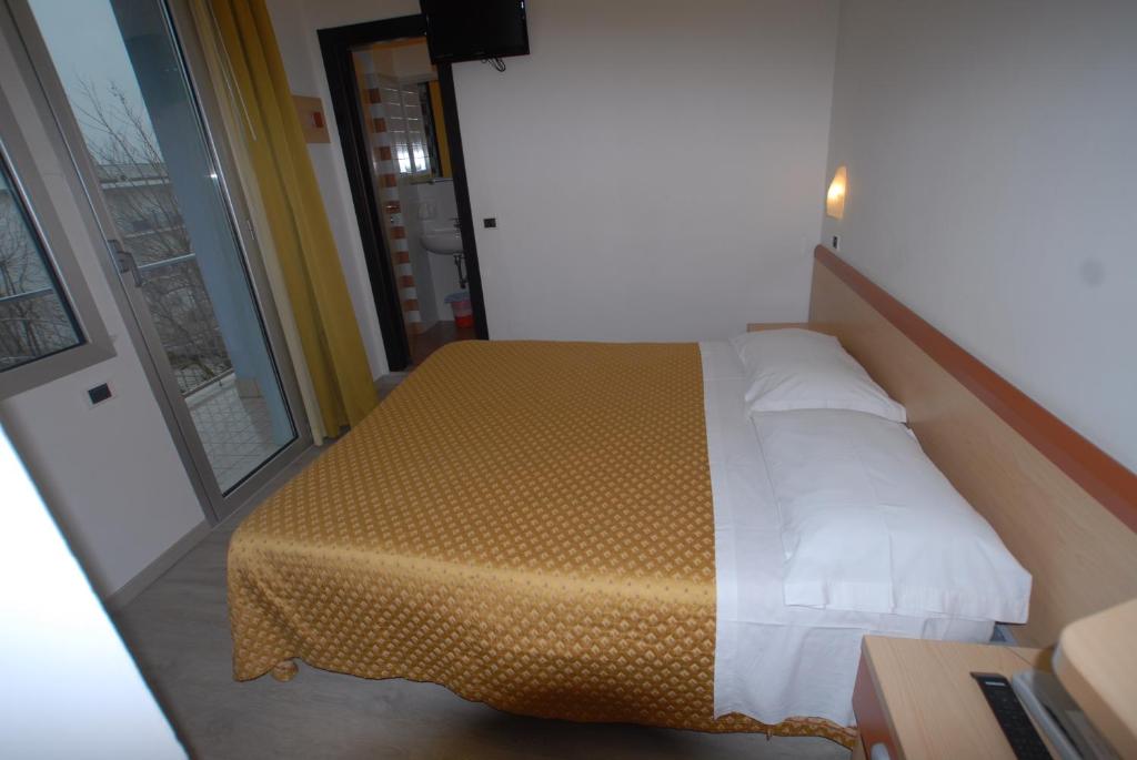 Postel nebo postele na pokoji v ubytování Hotel Tilmar