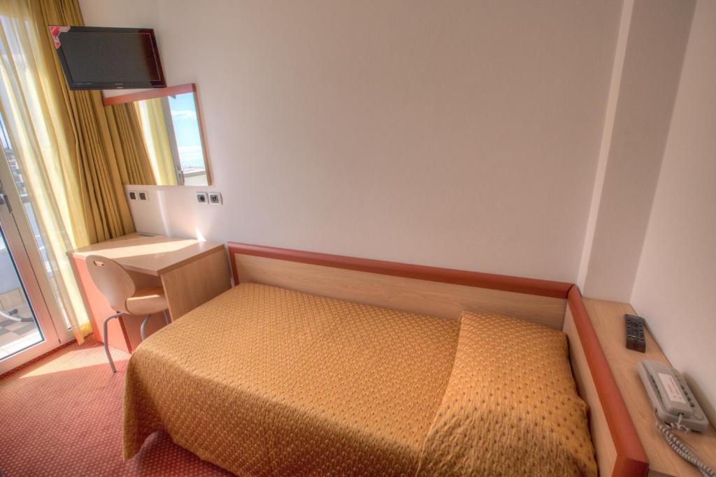 Postel nebo postele na pokoji v ubytování Hotel Tilmar