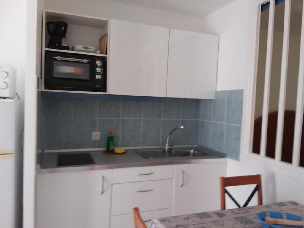 Kuchyň nebo kuchyňský kout v ubytování Jandia Attico Vista Oceano