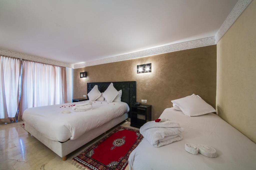 Postel nebo postele na pokoji v ubytování Zalagh Kasbah Hotel & Spa