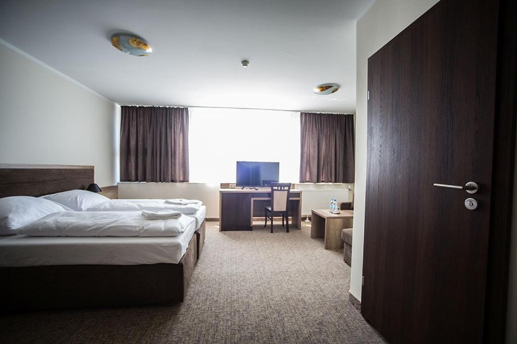 Postel nebo postele na pokoji v ubytování Hotel Cargo
