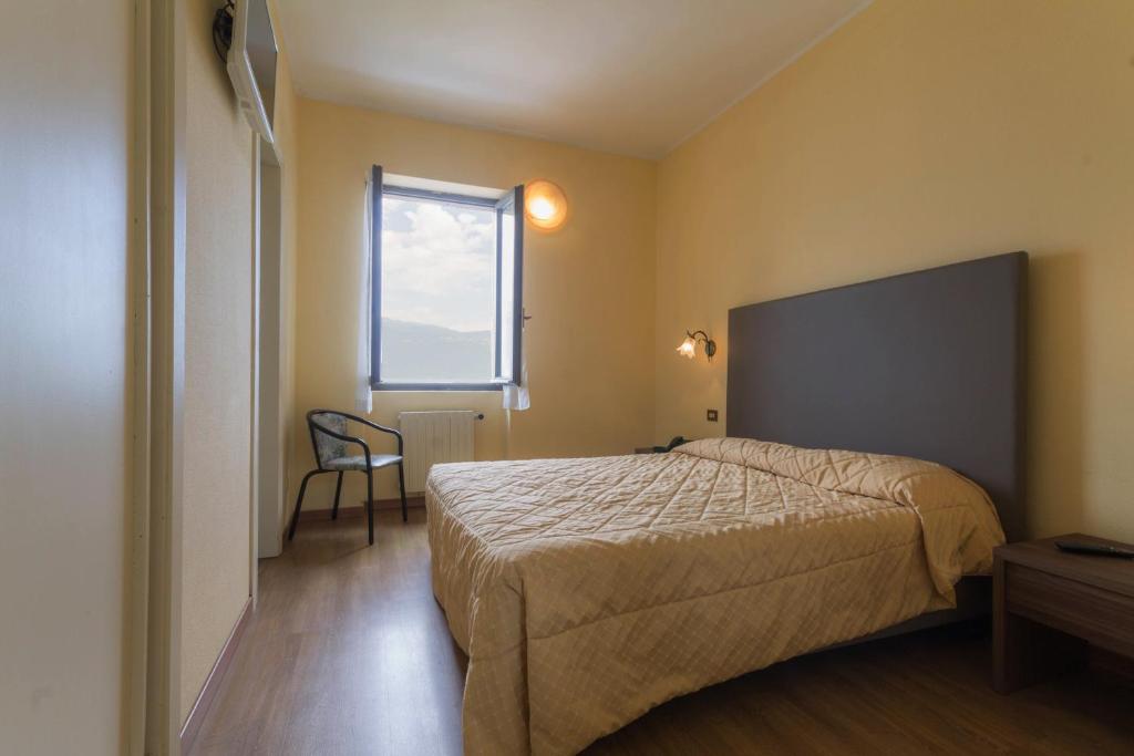 Postel nebo postele na pokoji v ubytování Hotel Lido