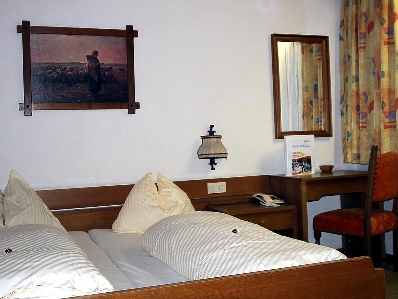 Postel nebo postele na pokoji v ubytování Landhotel Kaserer