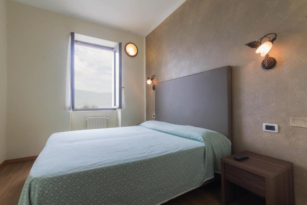 Postel nebo postele na pokoji v ubytování Hotel Lido
