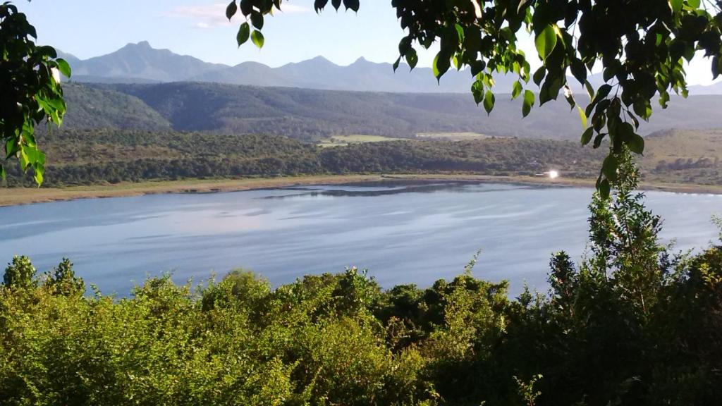 a view of a lake with mountains in the background at Eagles Nest in Sedgefield