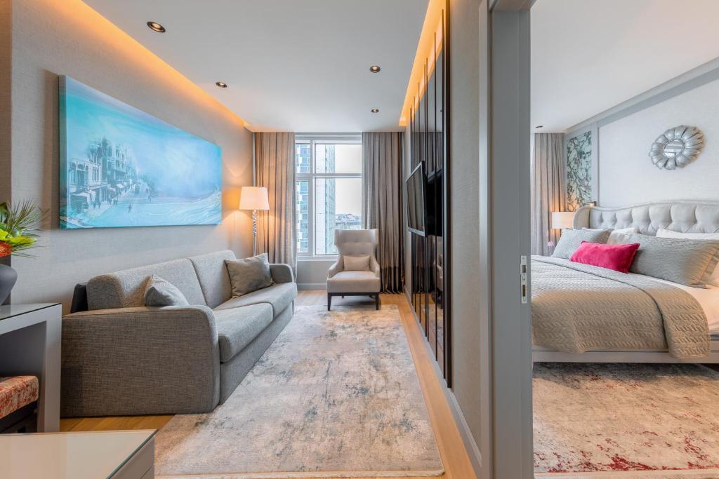 A bed or beds in a room at CVK Taksim Hotel Istanbul