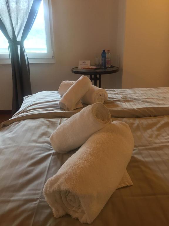 Postel nebo postele na pokoji v ubytování Albergo Ristorante Belcantone