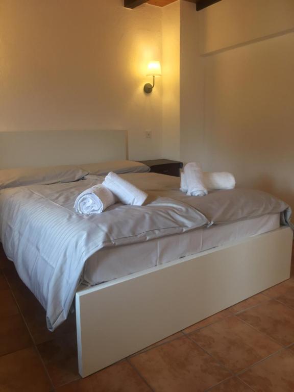 Postel nebo postele na pokoji v ubytování Albergo Ristorante Belcantone