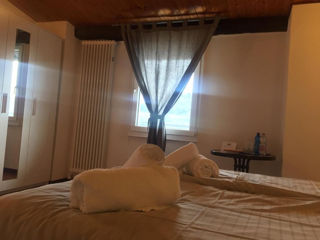 Postel nebo postele na pokoji v ubytování Albergo Ristorante Belcantone