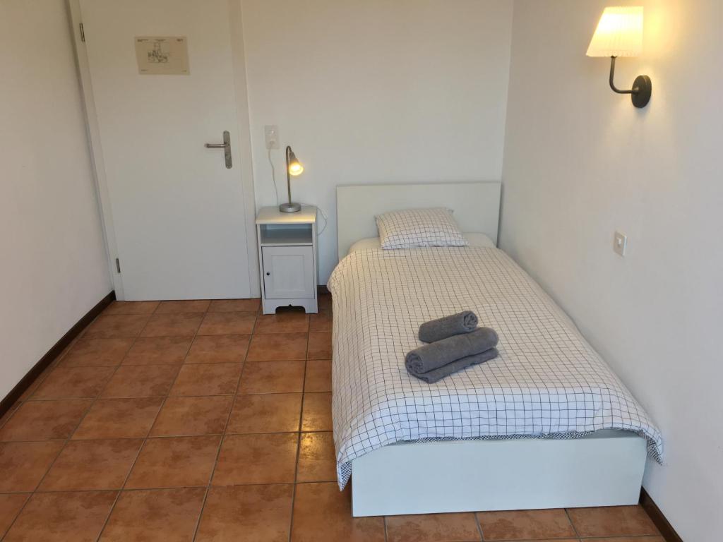 Postel nebo postele na pokoji v ubytování Albergo Ristorante Belcantone