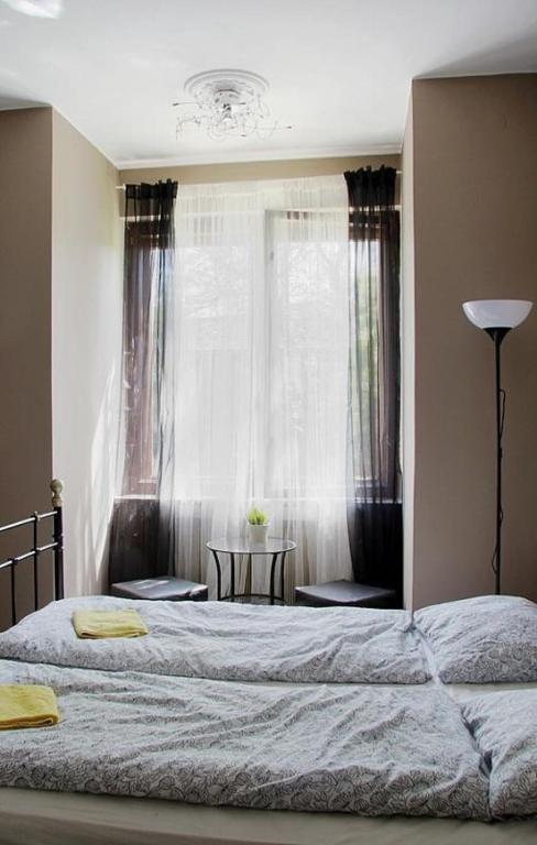 Posteľ alebo postele v izbe v ubytovaní 4 Couples & 4 Friends Hostel