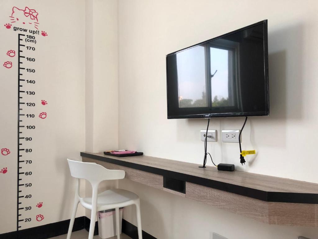 TV a/nebo společenská místnost v ubytování Country House Homestay