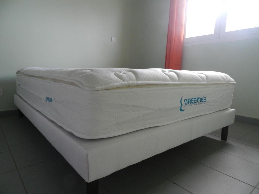 Postel nebo postele na pokoji v ubytování Coco D'Iles