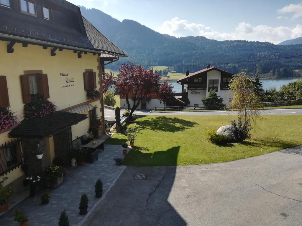 a view of the courtyard of a house at Haus Garz in Weissensee